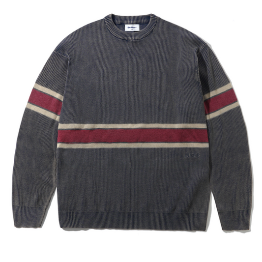 A dark gray ribbed knit crewneck sweater with horizontal stripes in burgundy and beige across the chest and sleeves, laid flat on a white background.