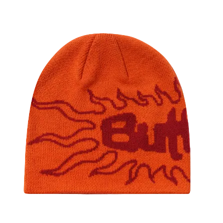 Bright orange knit beanie with a dark red knitted flame and stylized 'Butt' logo across the front, shown on a white background with a second partial beanie visible at the right edge.